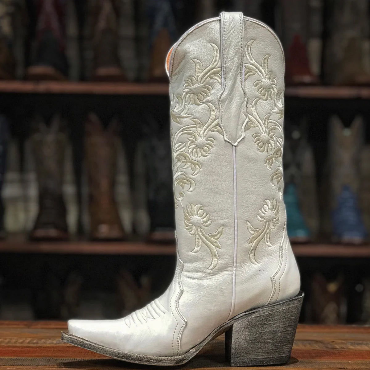 White cowgirl boots by Tanner Mark